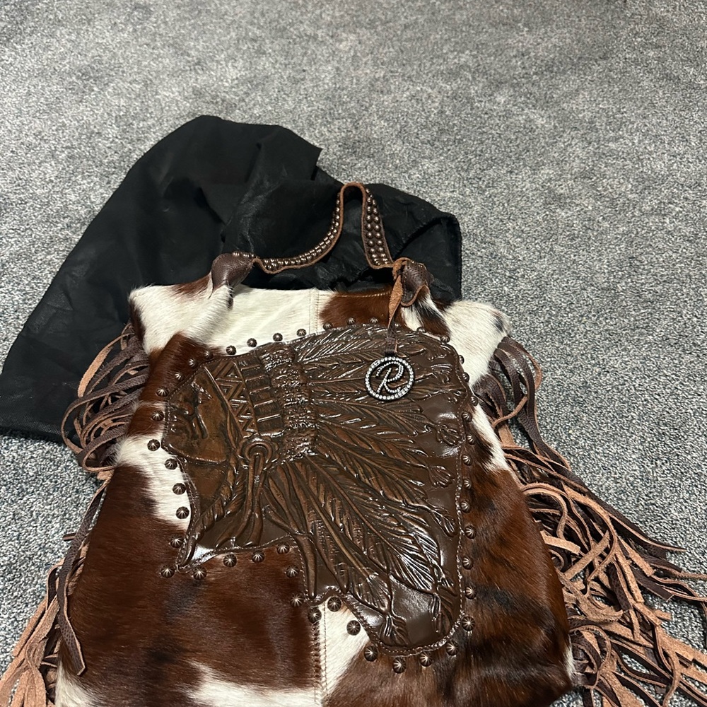 Raviani cow hide and leather purse with fringe